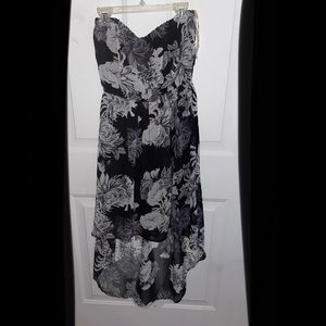 Strapless tube dress with floral print. High low fit. Sheer at bottom.